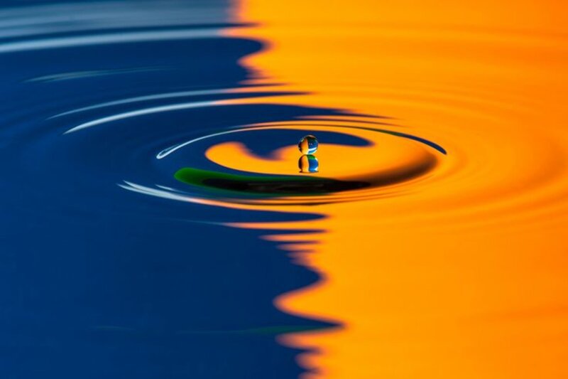 Droplet Creating Ripples — Blue, Calm, Sunset