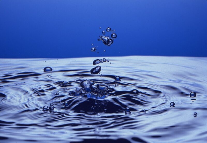 Droplet Hitting Water Surface — Blue, Calm, Photograph, Bubbles, Ripples, Splash