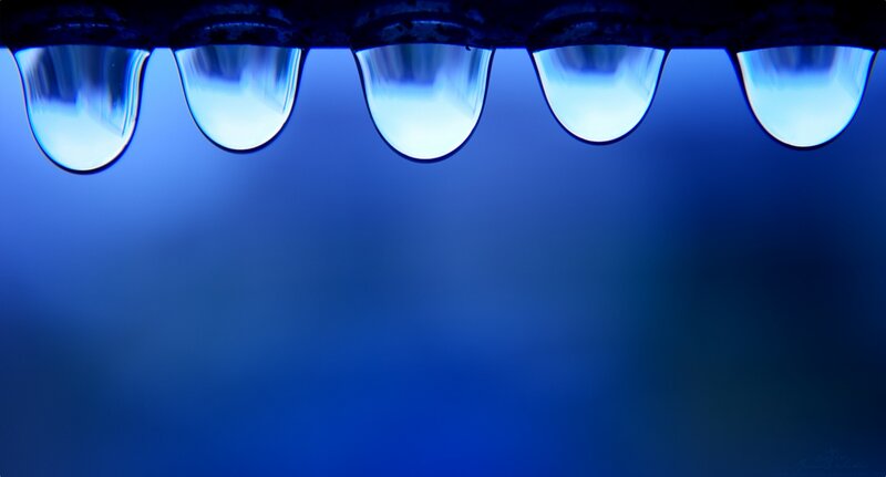 Droplets of liquid in a row