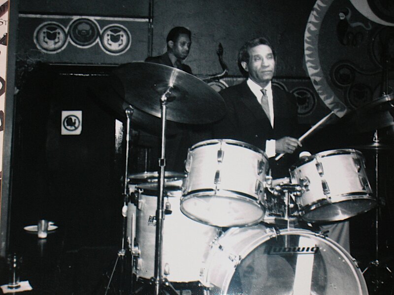 Drummer on Stage — Black, Focused