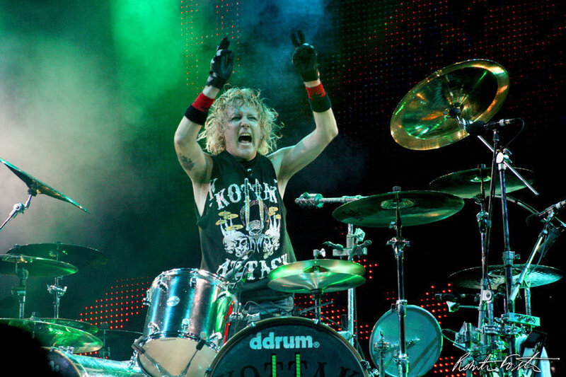 Drummer Performing on Stage — Green