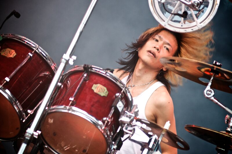Drummer Playing Drums — Red