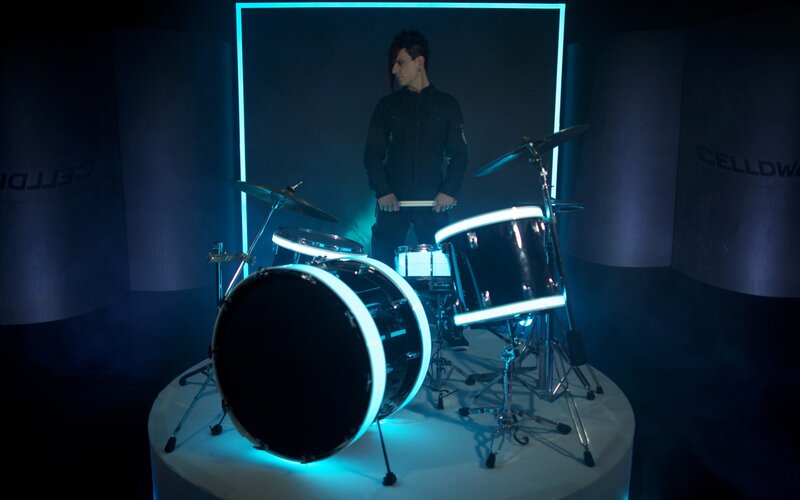 drummer with neon drum set