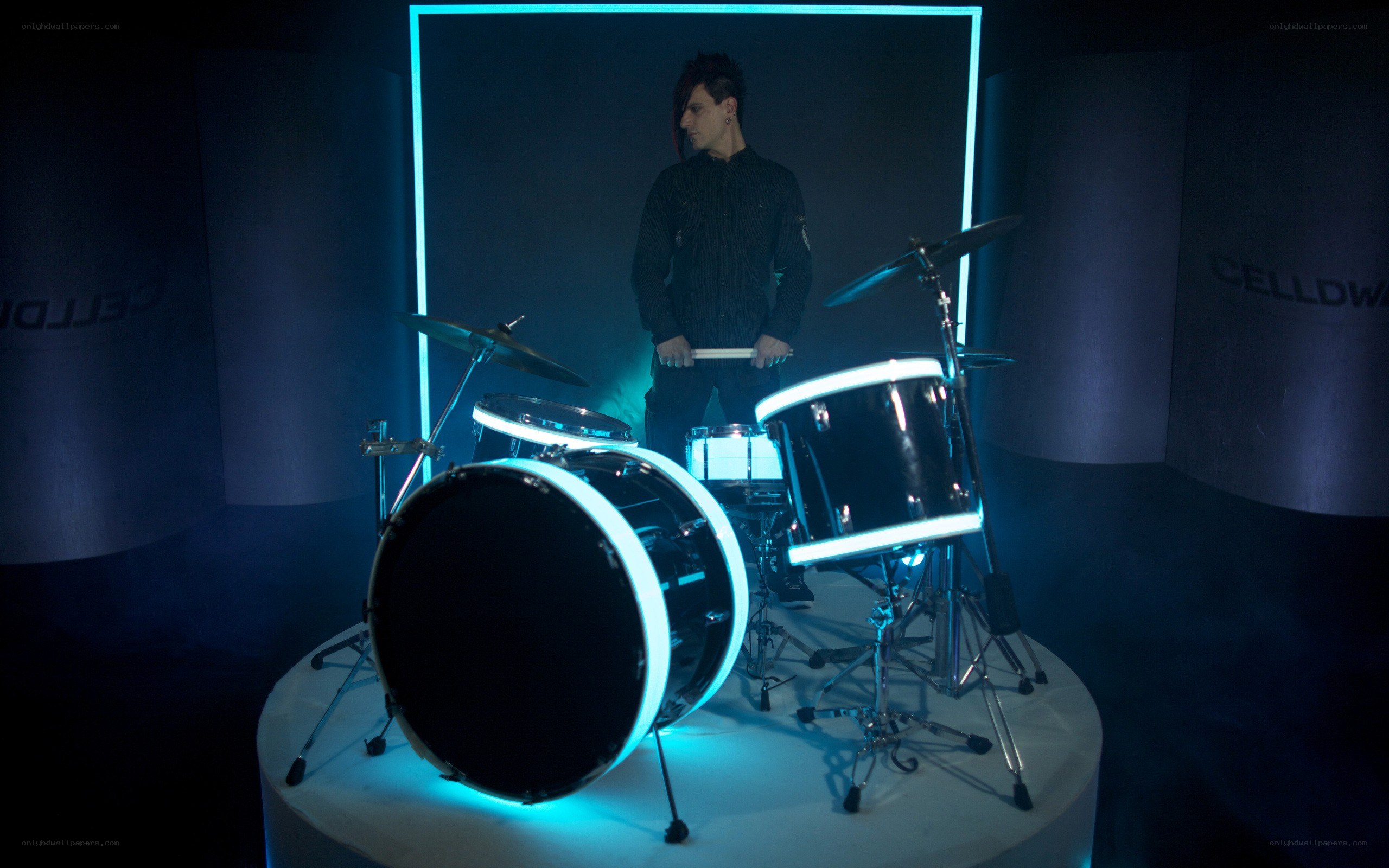 drummer with neon drum set