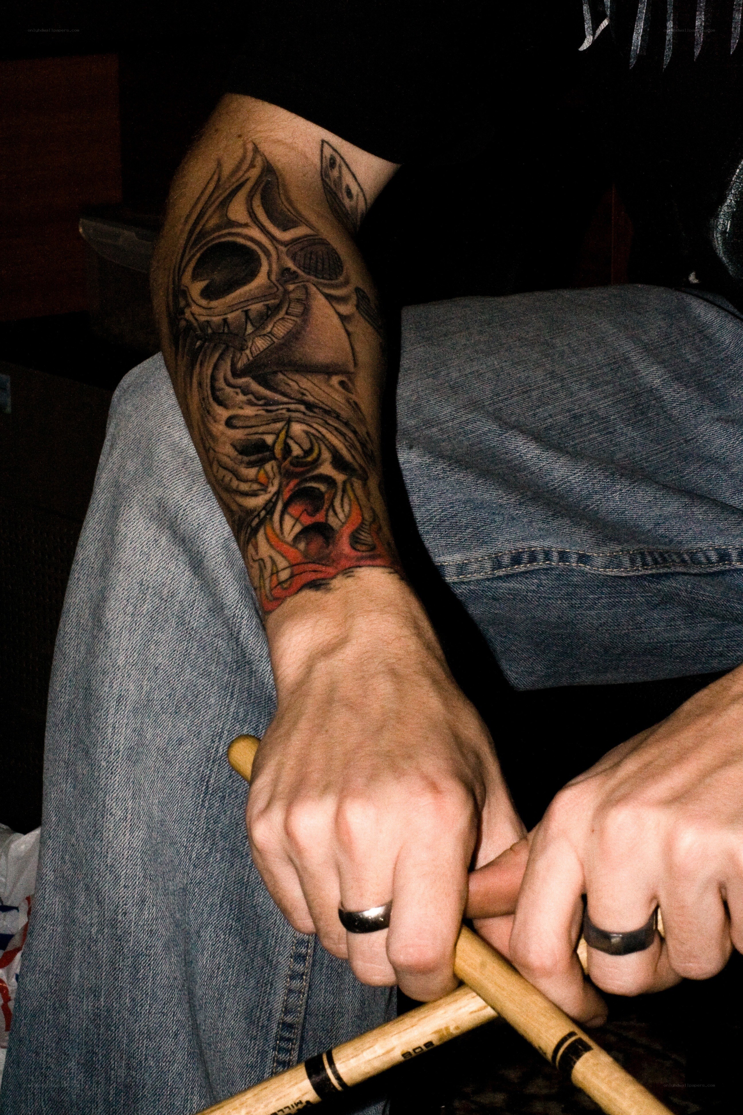 drummer with tattooed arm