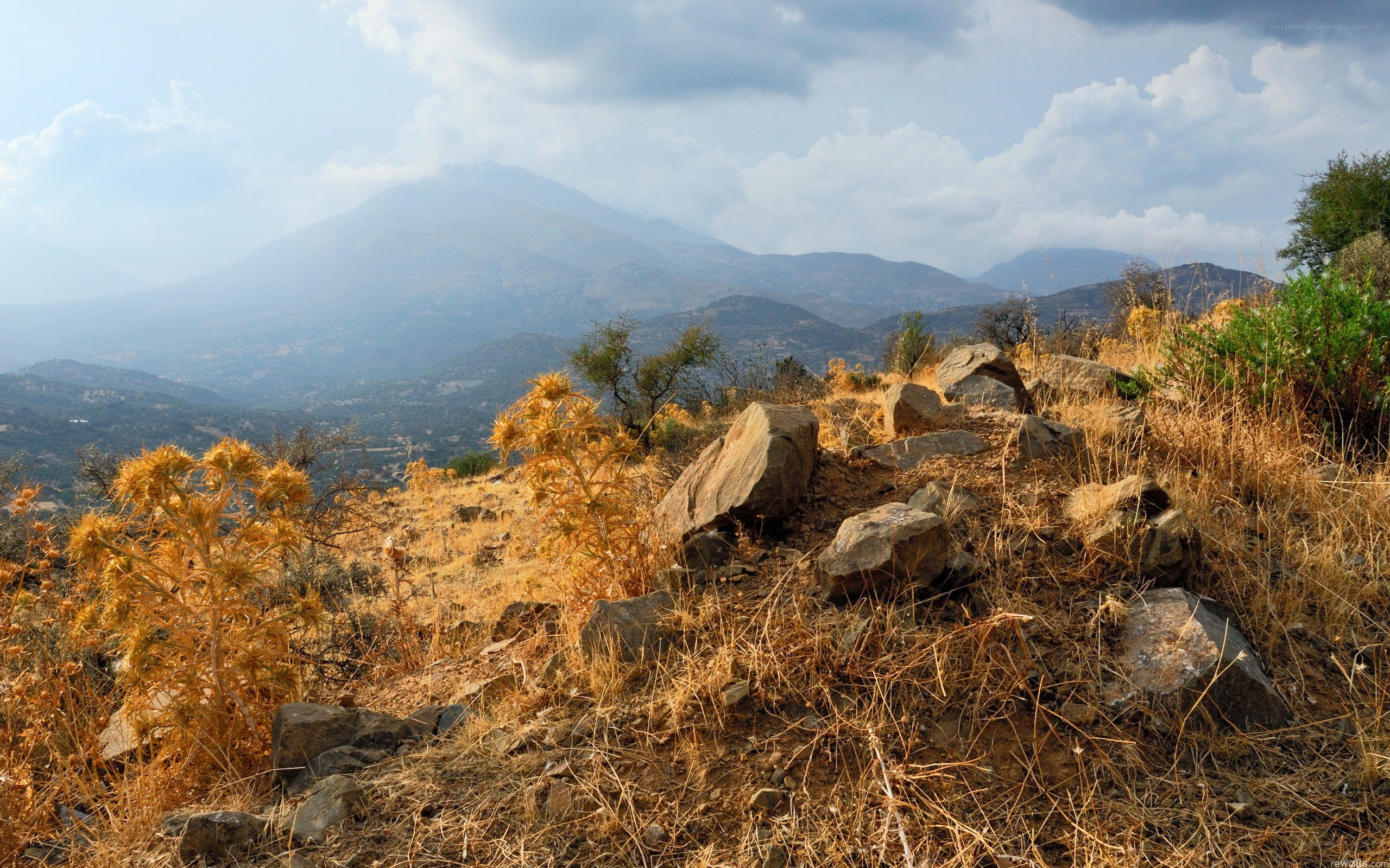 Dry mountain landscape with distant peaks