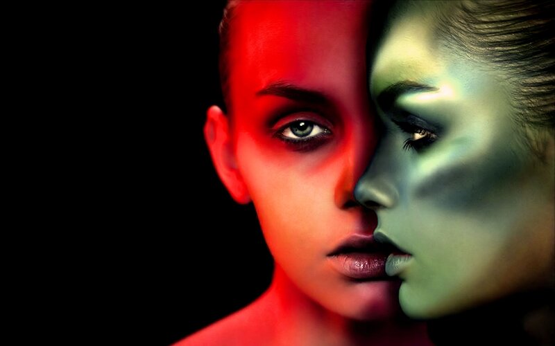 dual face portrait with colored lighting