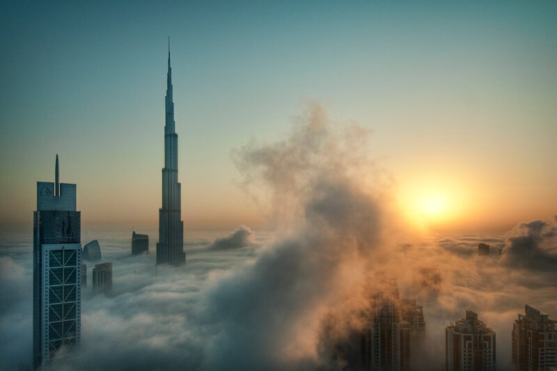 Dubai skyline above clouds