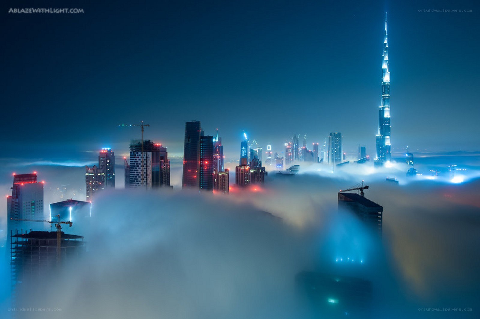 Dubai skyline above clouds