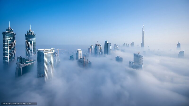 Dubai skyline above clouds