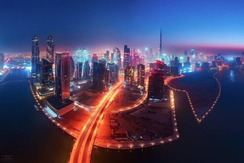 Dubai Skyline at Night — Blue, Dramatic, Photograph, Skyscrapers, Highway, Water