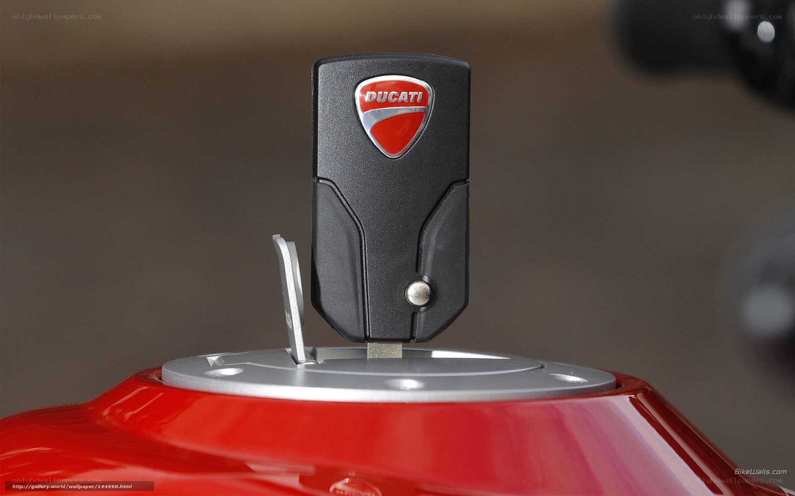 Ducati key on red motorcycle