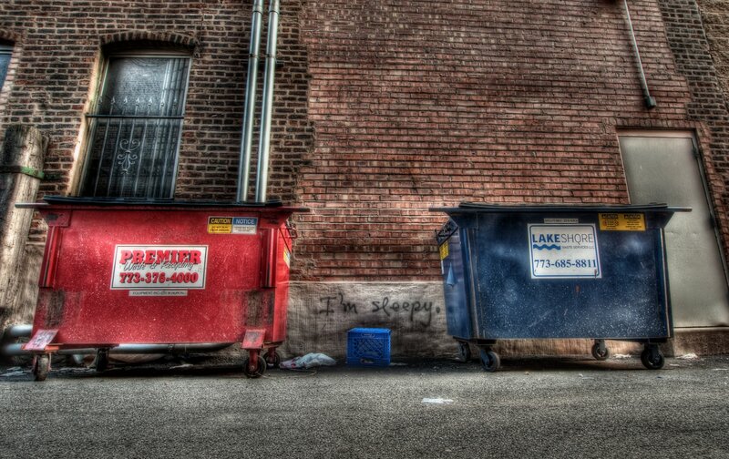 Dumpsters in alleyway