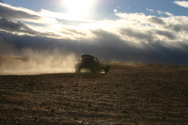 Dune buggy in dusty landscape