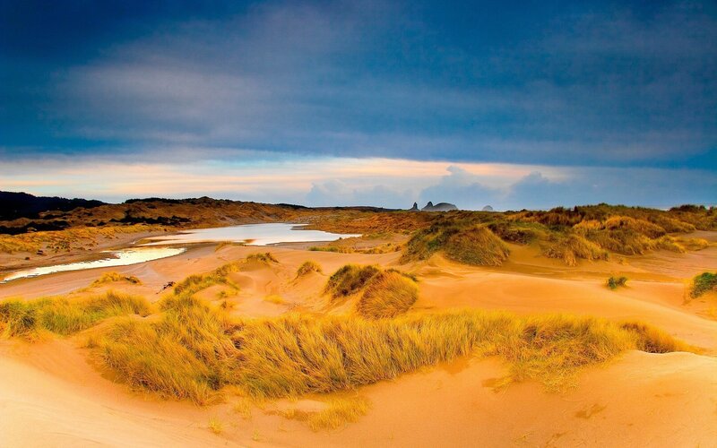 dunes and coastal lagoon at sunset