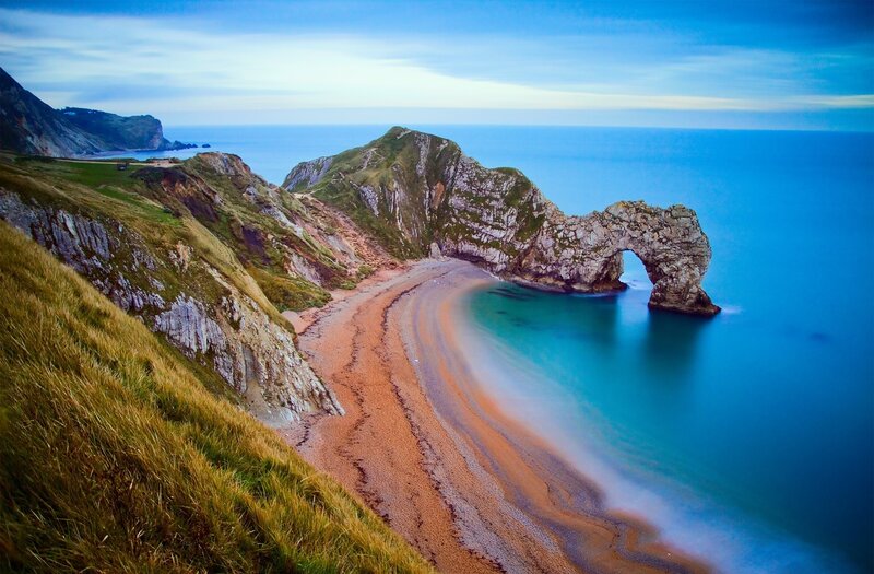 Durdle Door Rock Arch — Blue, Serene, Sunset, Photograph, Cliffs, Beach, Sea