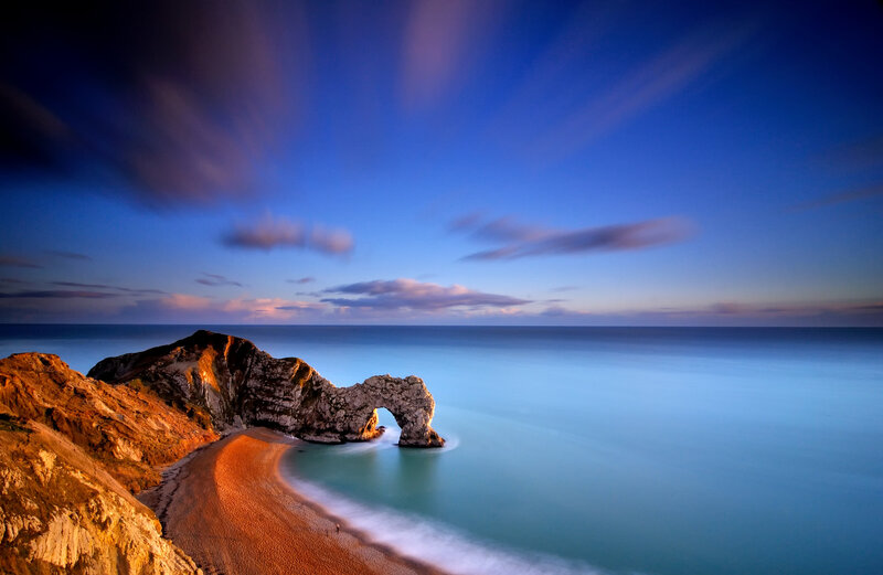 Durdle Door Rock Arch — Blue, Serene, Sunset, Photograph, Cliffs