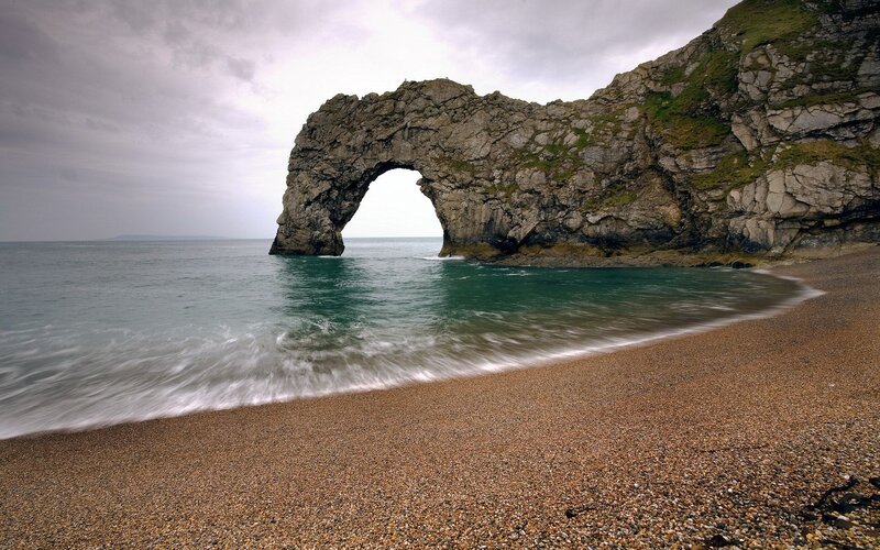 Durdle Door Rock Arch — Brown, Dramatic, Photograph