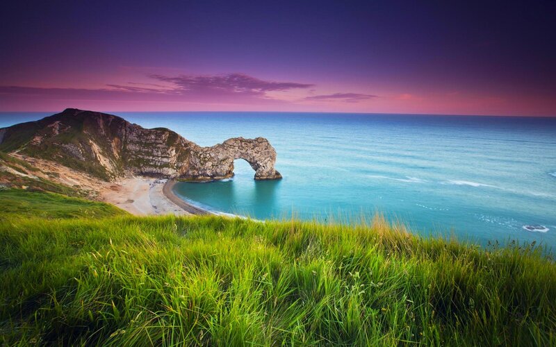 Durdle Door Rock Arch — Green, Serene, Sunset, Photograph, Cliff