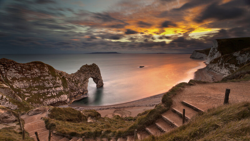 Durdle Door Rock Arch — Orange, Dramatic, Sunset, Photograph, Cliffs, Beach