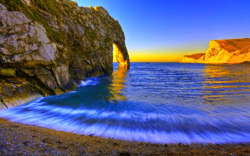 Durdle Door Rock Formation — Blue, Dramatic
