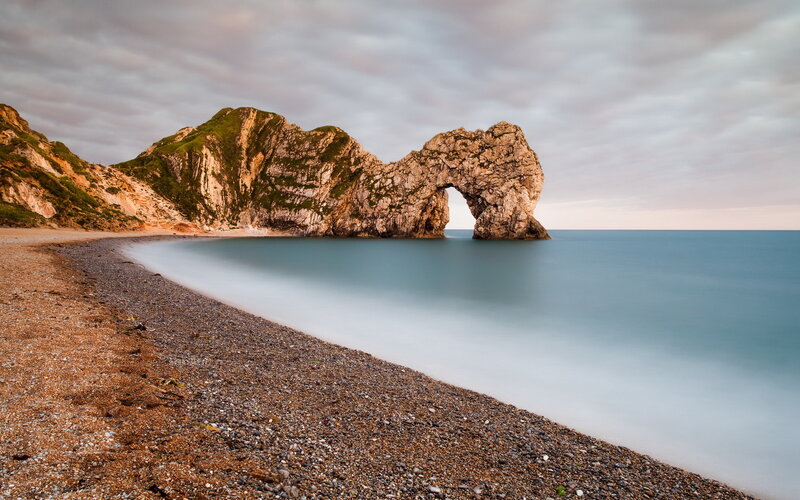 Durdle Door Rock Formation — Blue, Serene, Sunset, Photograph