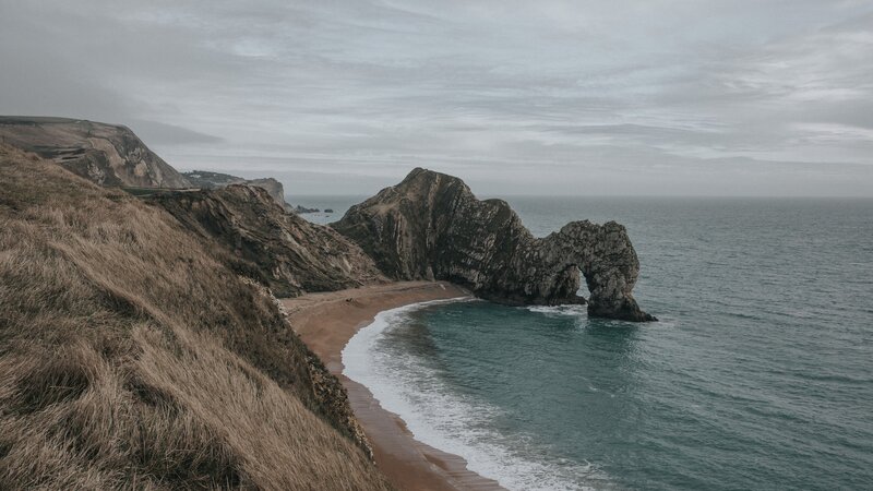 Durdle Door Rock Formation — Gray, Overcast
