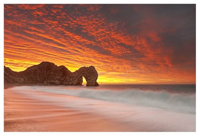 Durdle Door Rock Formation — Orange, Dramatic