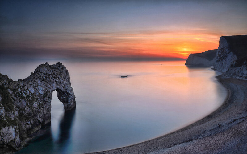 Durdle Door Rock Formation — Orange, Serene, Sunset