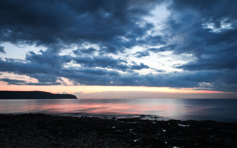 dusk over the rocky shore