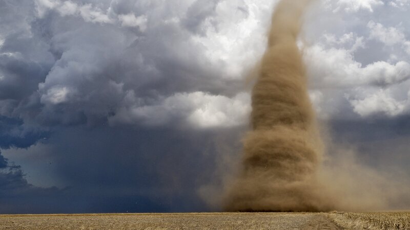 Dust devil in a storm