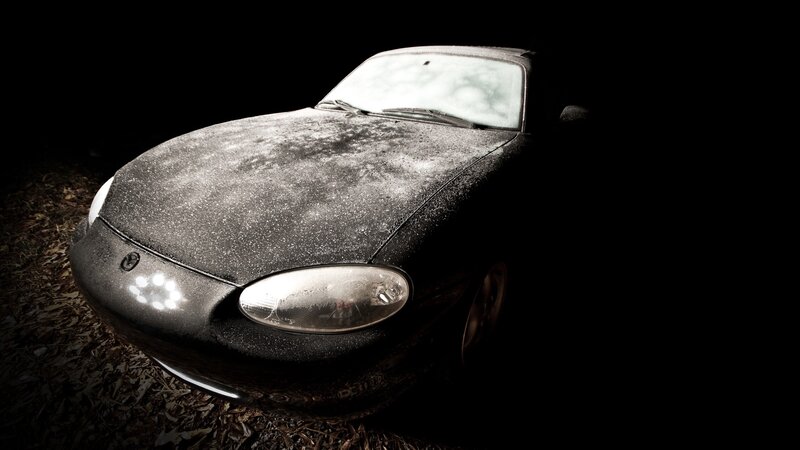 dusty car in dark setting