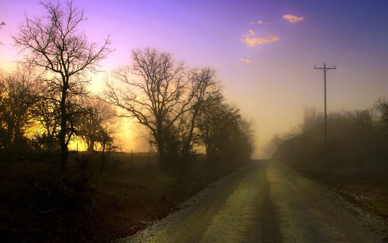 Dusty road at sunrise