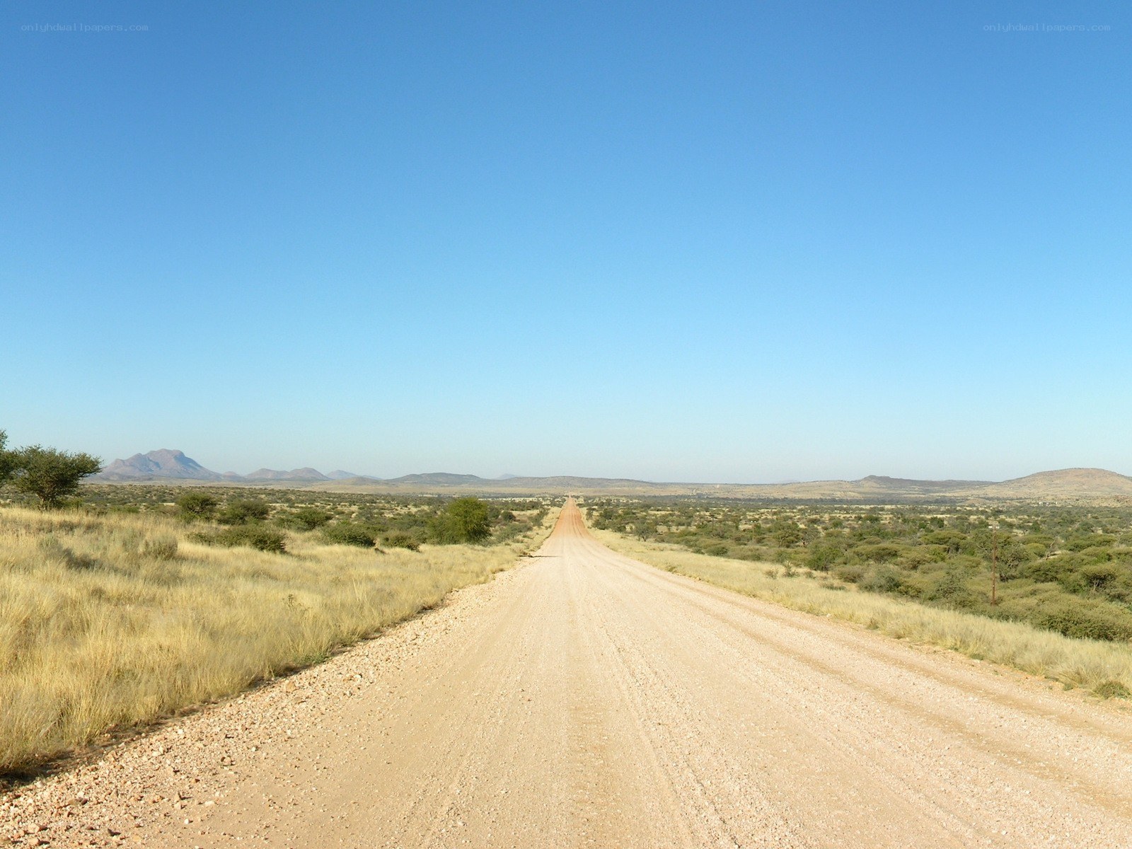 Dusty road in arid landscape