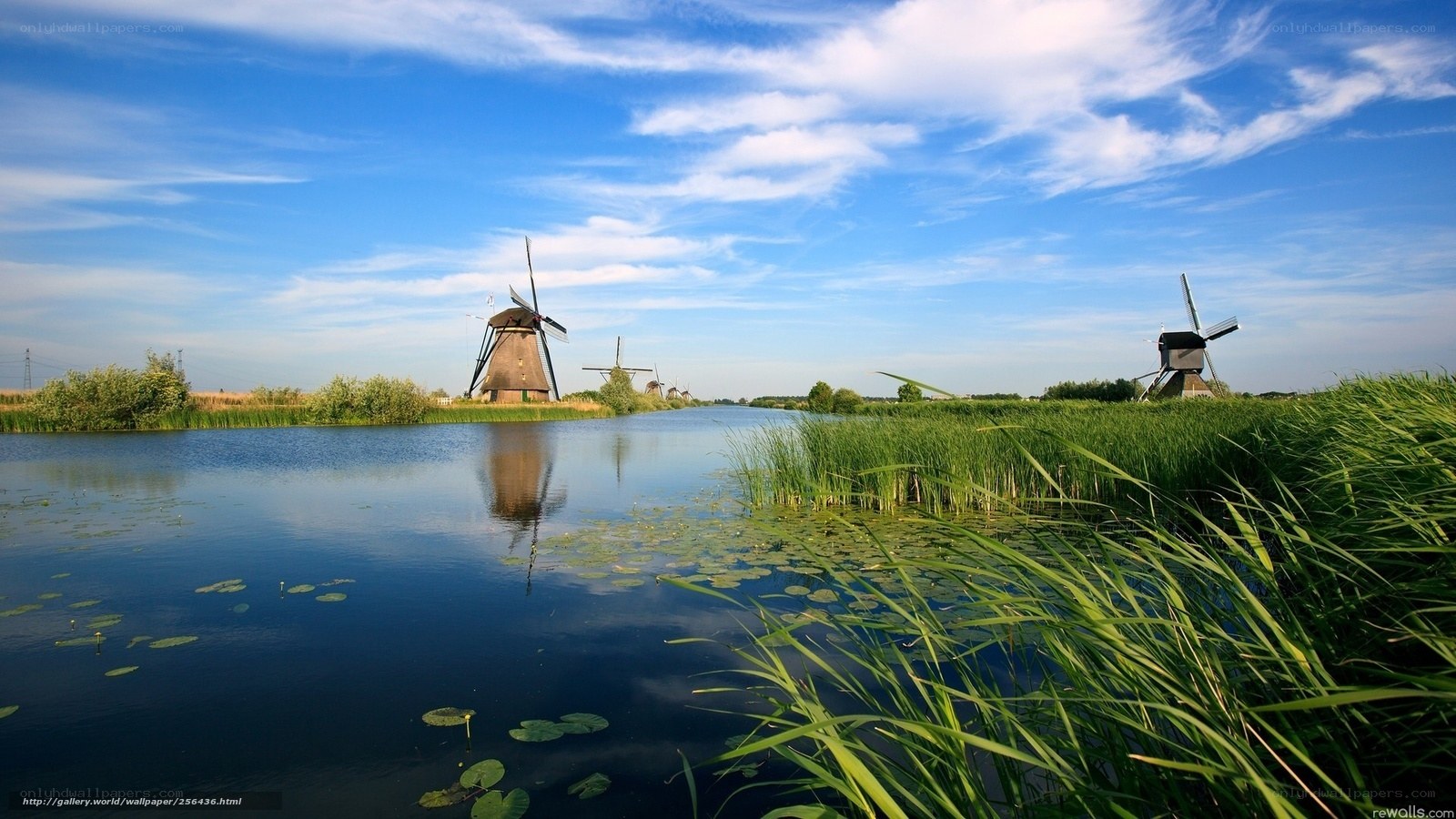 Dutch windmills by a canal