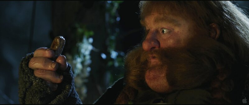 dwarf holding a small object