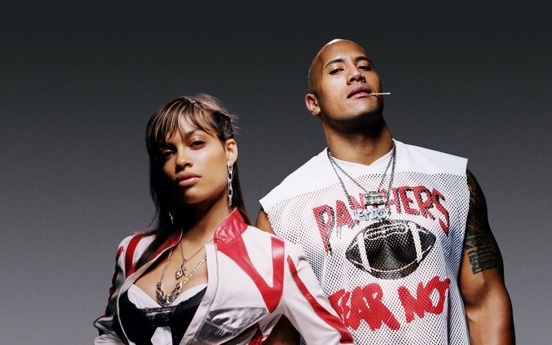 Dwayne Johnson and a woman posing