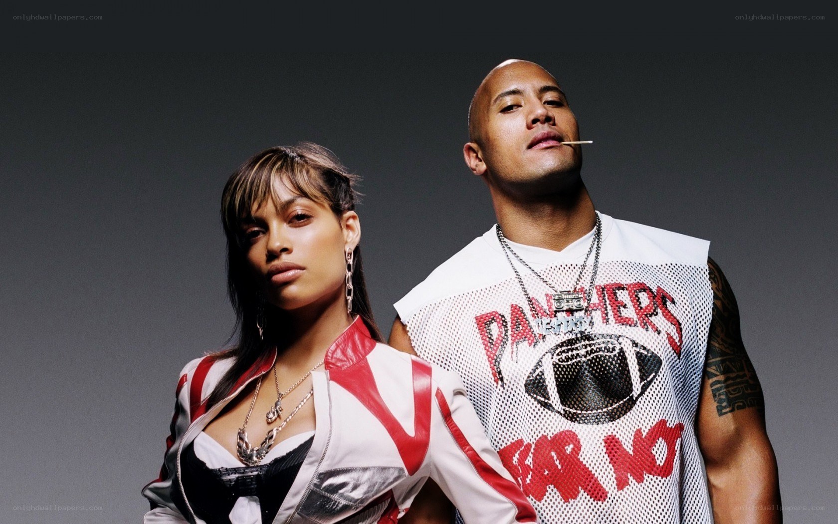 Dwayne Johnson and a woman posing