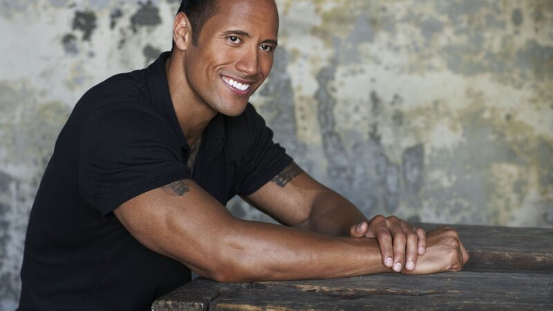 Dwayne Johnson smiling at camera
