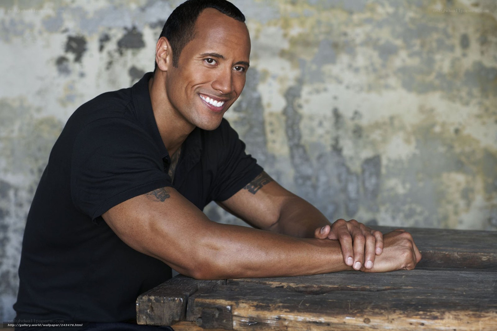 Dwayne Johnson smiling at table