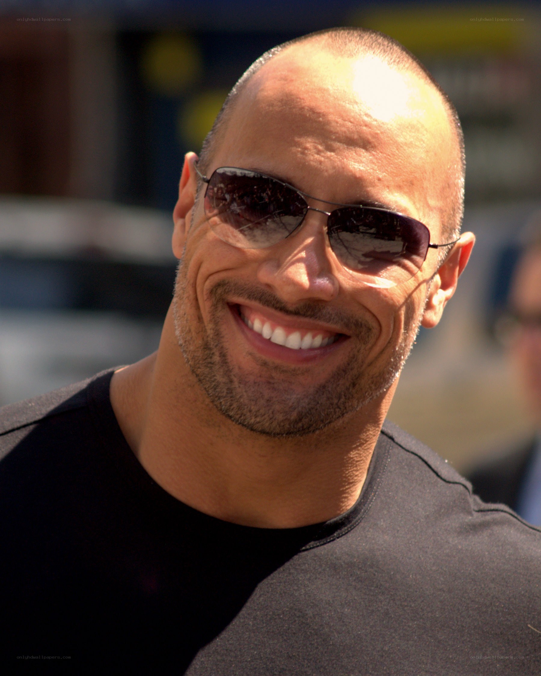 Dwayne Johnson smiling in sunglasses