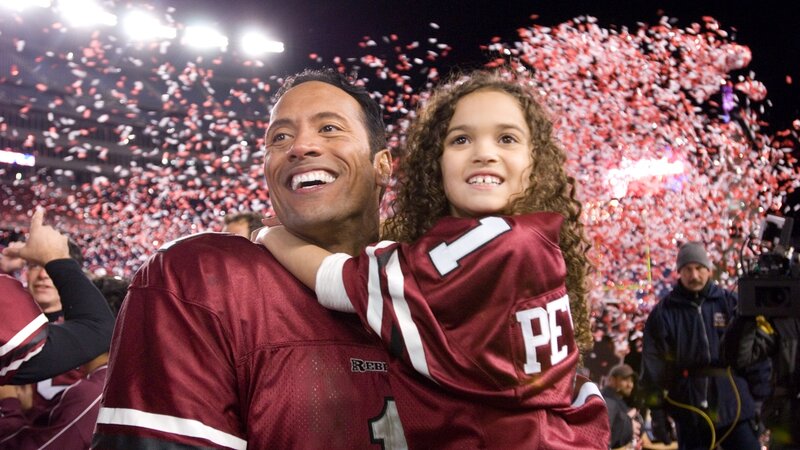 Dwayne Johnson with daughter at football game