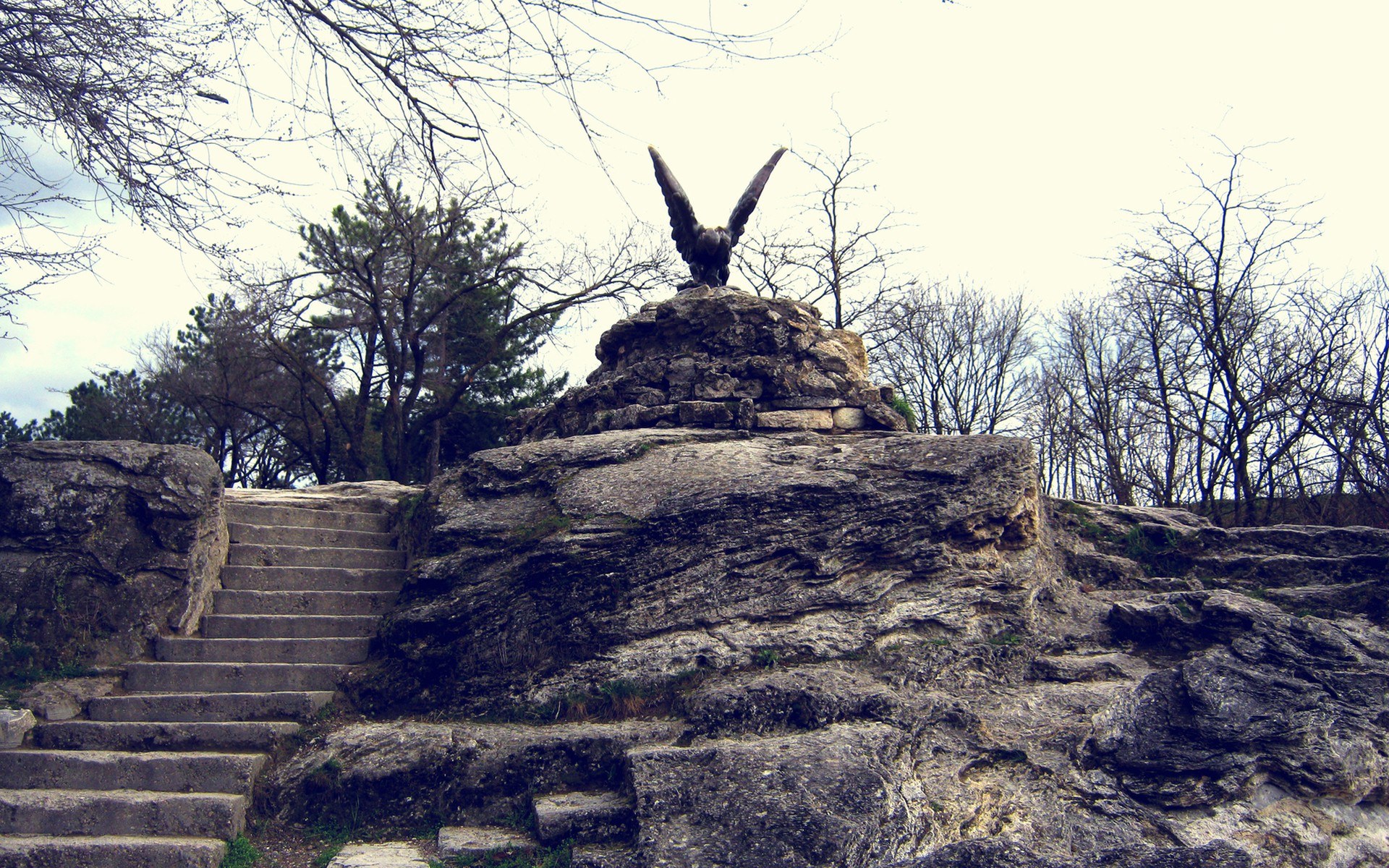 Eagle statue on rocky hill
