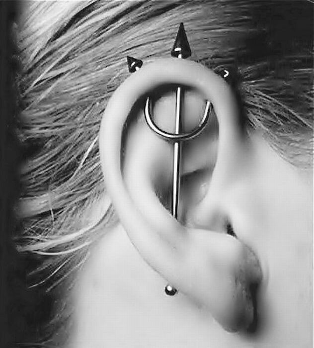 ear piercing with devil horns