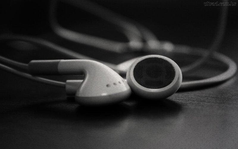 earbuds on dark surface