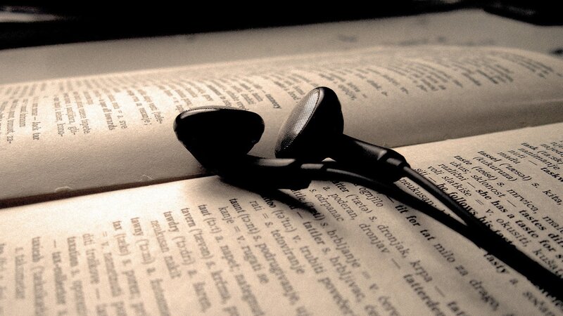 earbuds on open book