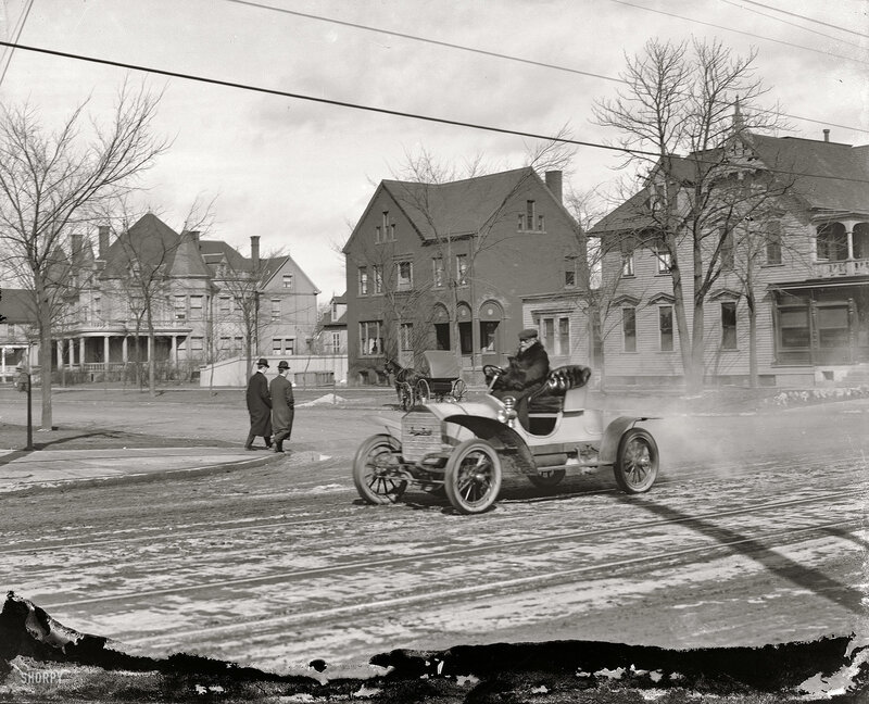 Early automobile on a snowy street