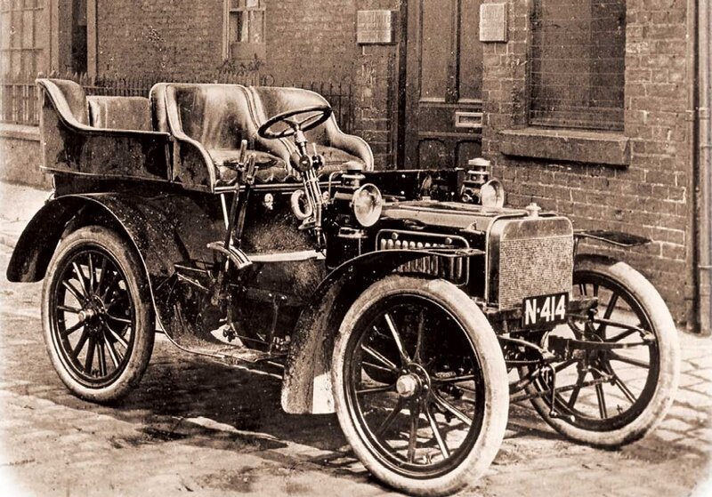 Early Automobile on Street — Black