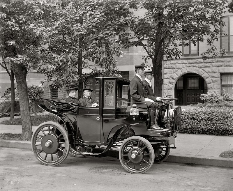 Early automobile with passengers