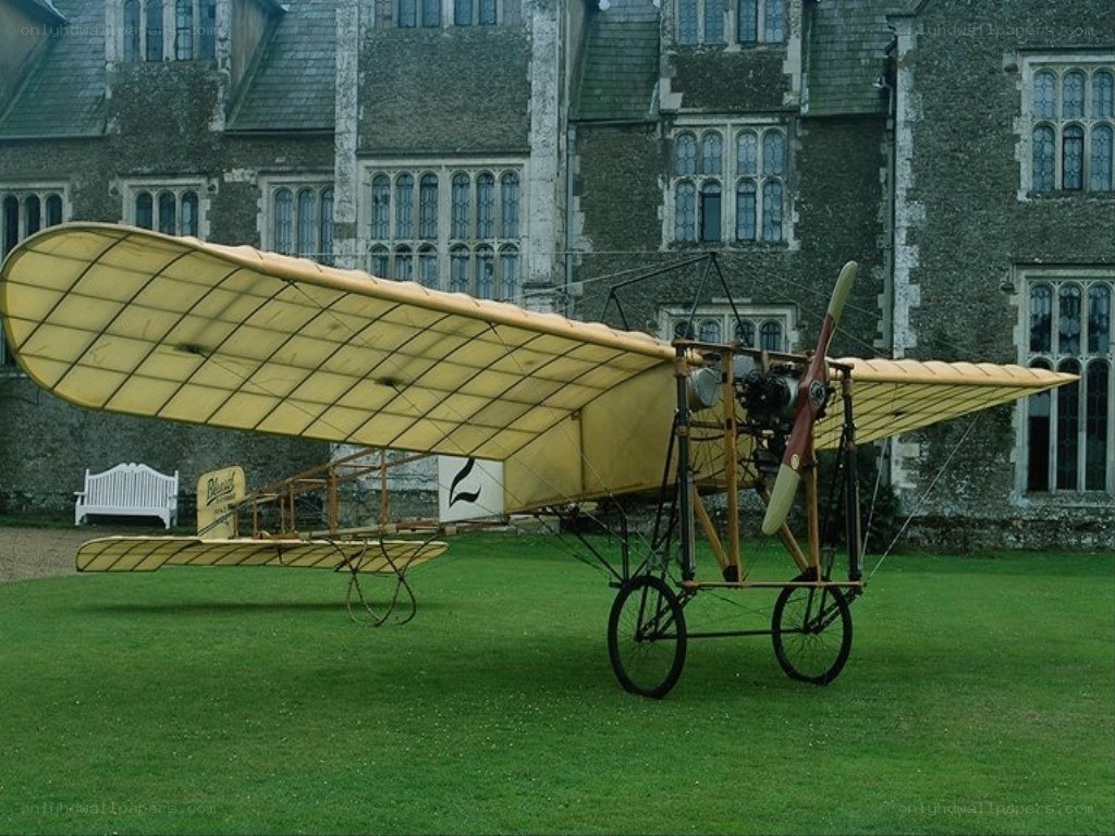 Early biplane on a lawn